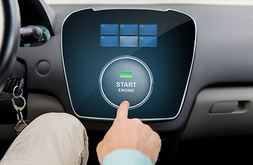 Image showing close up of man using starter application in car