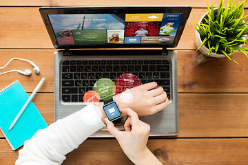 Image showing close up of woman with smart watch and laptop