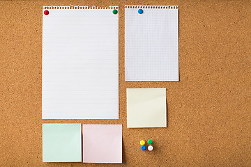 Image showing close up of blank stickers and paper on cork board