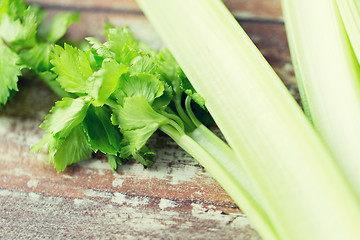 Image showing close up of celery stems on wooden table