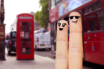 Image showing close up of two fingers with smiley faces
