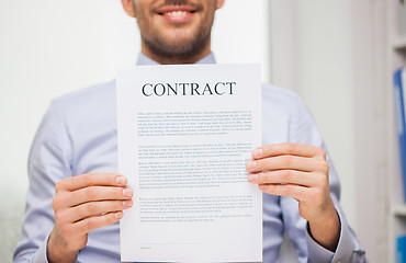 Image showing close up of businessman holding contract document