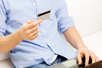 Image showing close up of man with laptop and credit card