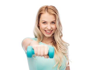 Image showing smiling beautiful young sporty woman with dumbbell