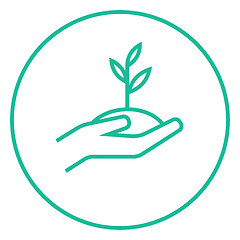 Image showing Hands holding seedling in soil line icon.