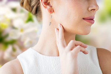 Image showing close up of beautiful woman face with gold earring