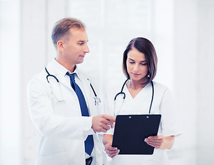 Image showing two doctors writing prescription