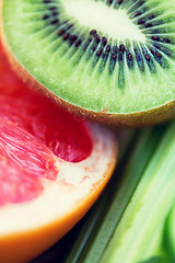 Image showing close up of ripe kiwi and grapefruit slices