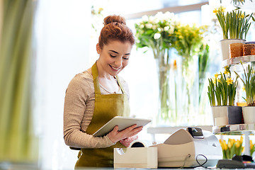 Image showing woman with tablet pc computer at flower shop