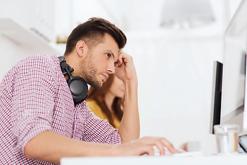 Image showing stressed software developer at office