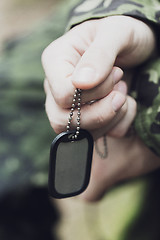 Image showing close up of young soldier in military uniform