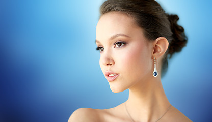 Image showing close up of beautiful woman face with earring