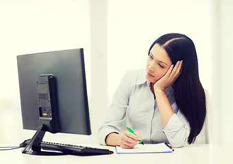 Image showing tired businesswoman or student