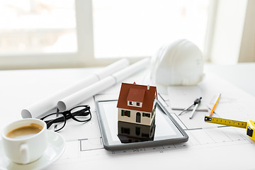 Image showing close up of living house model on tablet pc