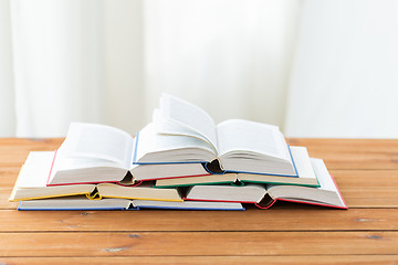 Image showing close up of books on wooden table