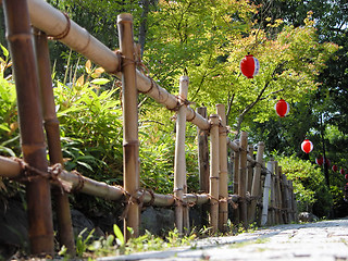 Image showing Bamboo fence and papers lanterns