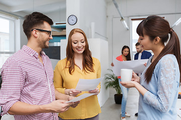 Image showing creative team on coffee break talking at office