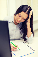 Image showing tired businesswoman or student