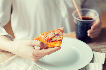 Image showing close up of woman with pizza and cola drink