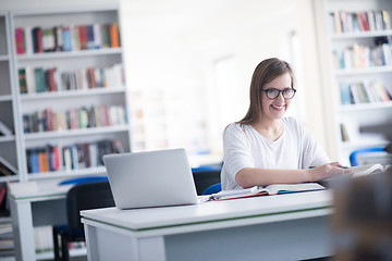 Image showing female student study in school library