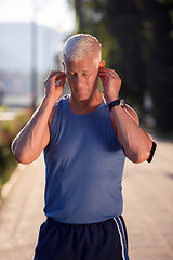 Image showing portrait of handsome senior jogging man