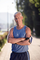 Image showing portrait of handsome senior jogging man