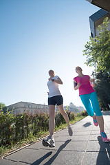 Image showing female friends jogging