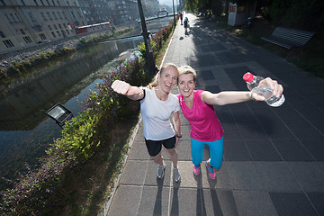 Image showing female friends jogging