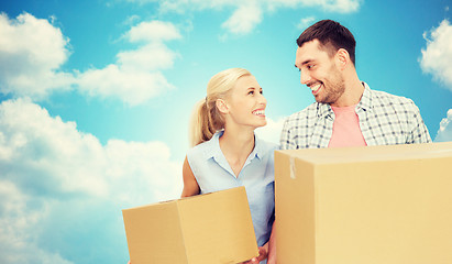 Image showing couple with cardboard boxes moving to new home