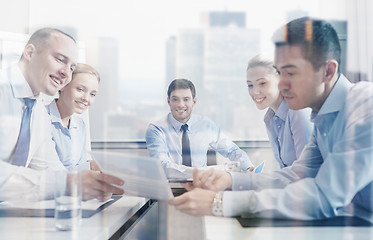 Image showing group of smiling businesspeople meeting in office