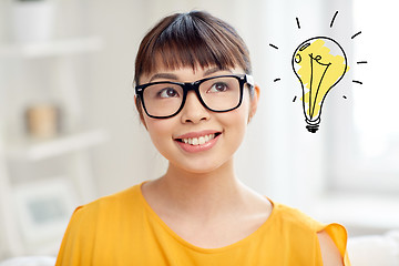 Image showing asian woman in glasses with light bulb doodle