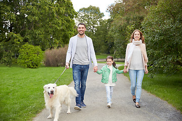 Image showing happy family with labrador retriever dog in park