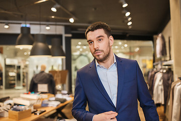 Image showing young handsome man in jacket at clothing store
