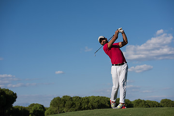 Image showing golf player hitting long shot