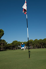 Image showing golf player aiming perfect  shot