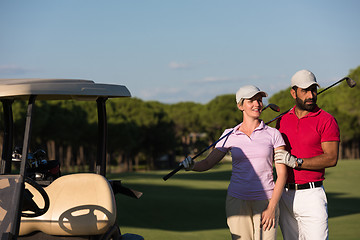 Image showing couple in buggy on golf course