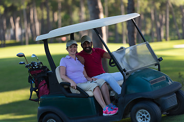 Image showing couple in buggy on golf course