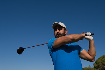 Image showing golf player hitting shot