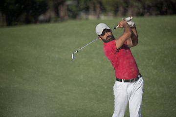 Image showing golfer hitting a sand bunker shot