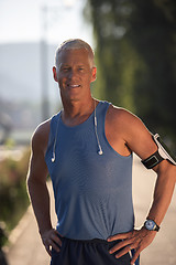 Image showing portrait of handsome senior jogging man