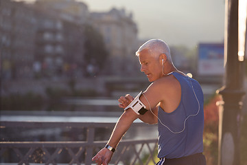 Image showing portrait of handsome senior jogging man