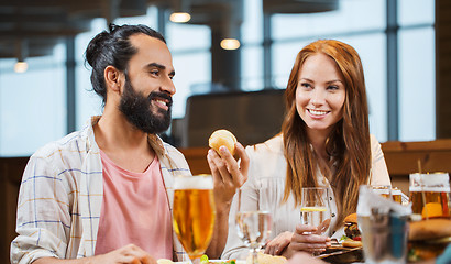 Image showing friends dining and drinking beer at restaurant