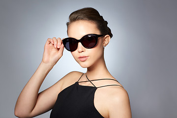 Image showing beautiful young woman in elegant black sunglasses