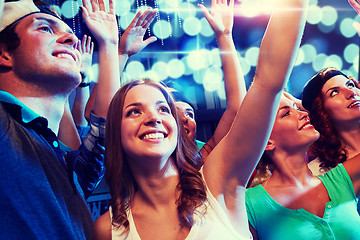 Image showing smiling friends at concert in club