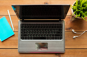 Image showing close up of laptop computer on wooden table