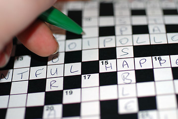 Image showing Filling In a Crossword Puzzle