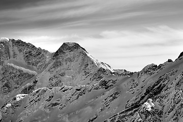 Image showing Black and white high mountains in winter evening