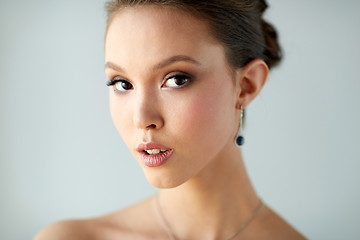 Image showing close up of beautiful woman face with earring