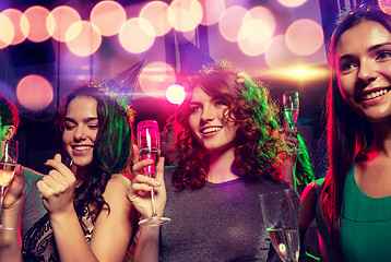 Image showing smiling friends with glasses of champagne in club