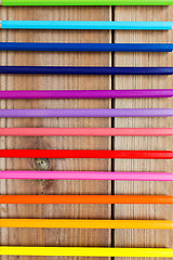 Image showing close up of crayons or color pencils on wood